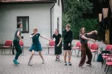 The coaches of the Green Academy dance in the yard