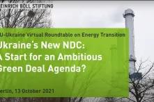 screensaver with the name of the event on a green-gray background