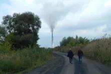 Landscape with two people walking on the road