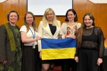 Participants of the discussion with Ukrainian flag