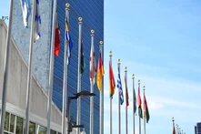 UN Building in New York with flags lined 