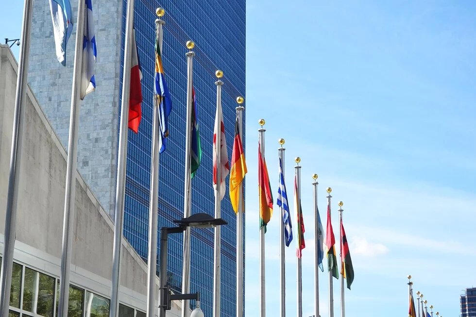 UN Building in New York with flags lined 